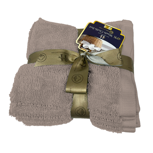 Folded beige towel set with a gold ribbon and tag on a white background