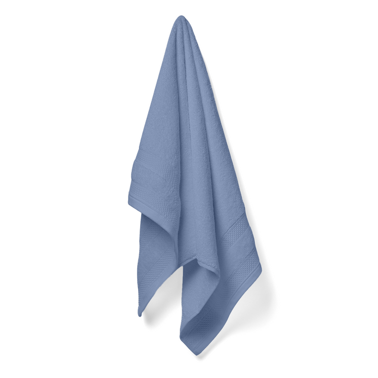 Blue towel hanging on a white background