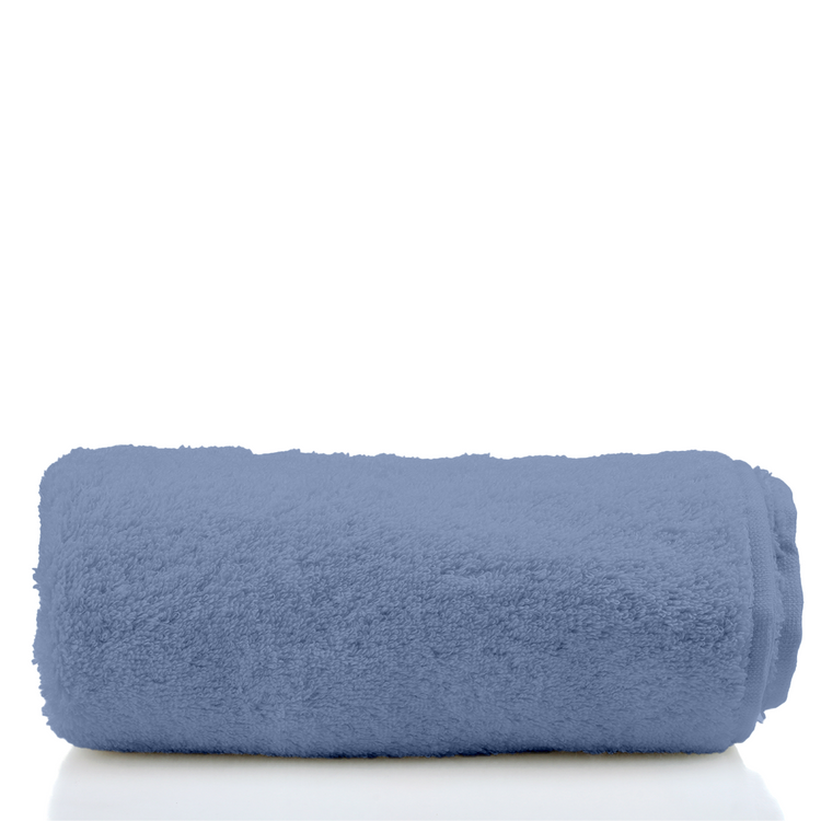 Rolled blue towel on a white background