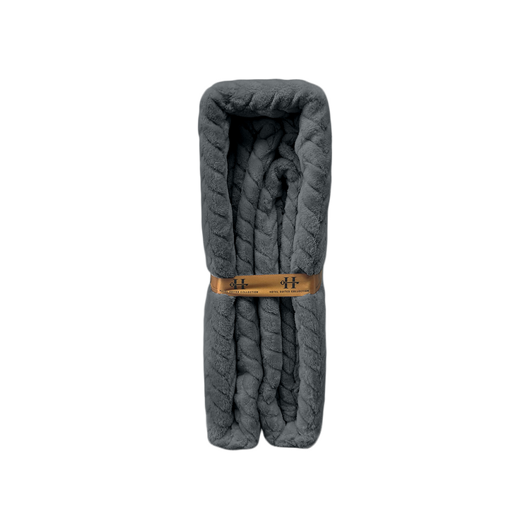 Gray quilted blanket with a wooden buckle on a white background