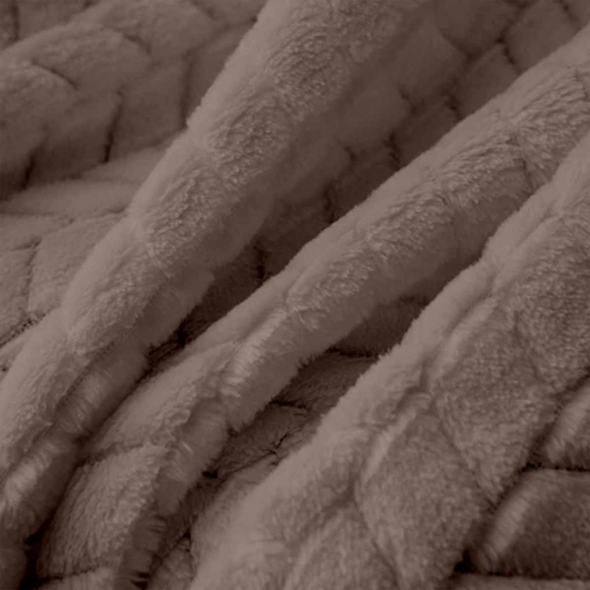 Close-up of a textured brown fabric surface