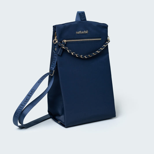 Navy blue handbag with a chain detail on a light gray background