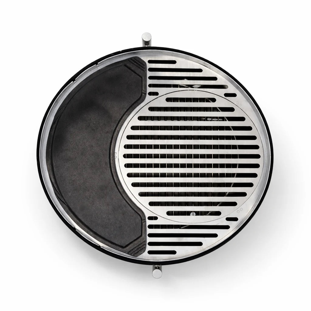 Round metal grill with black interior on a white background