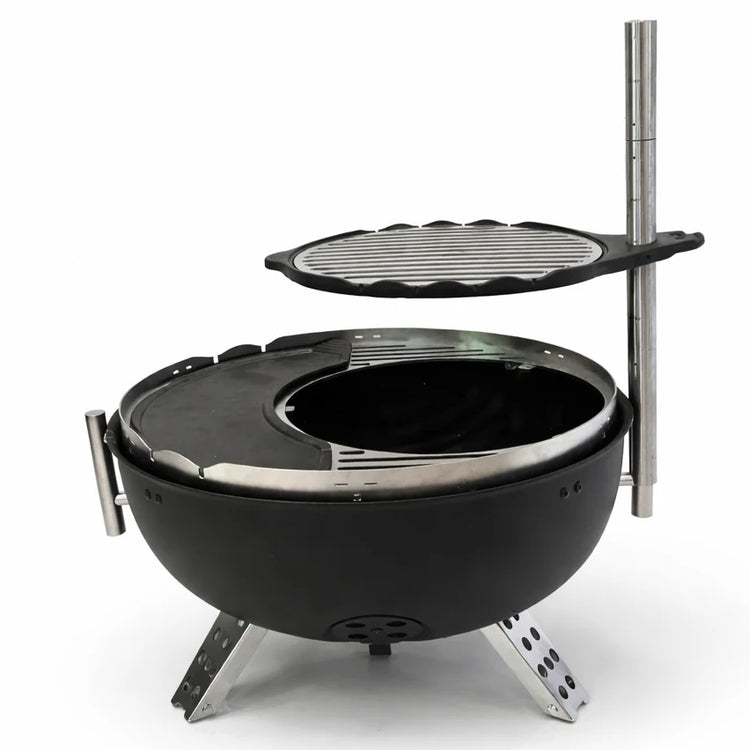 Black portable grill with a detachable grilling surface on a white background