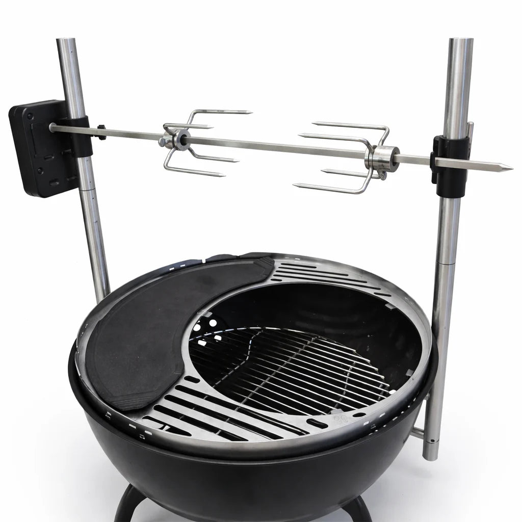 Black grill with rotisserie system on a white background