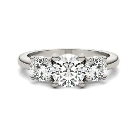 Three-stone diamond ring on a white background