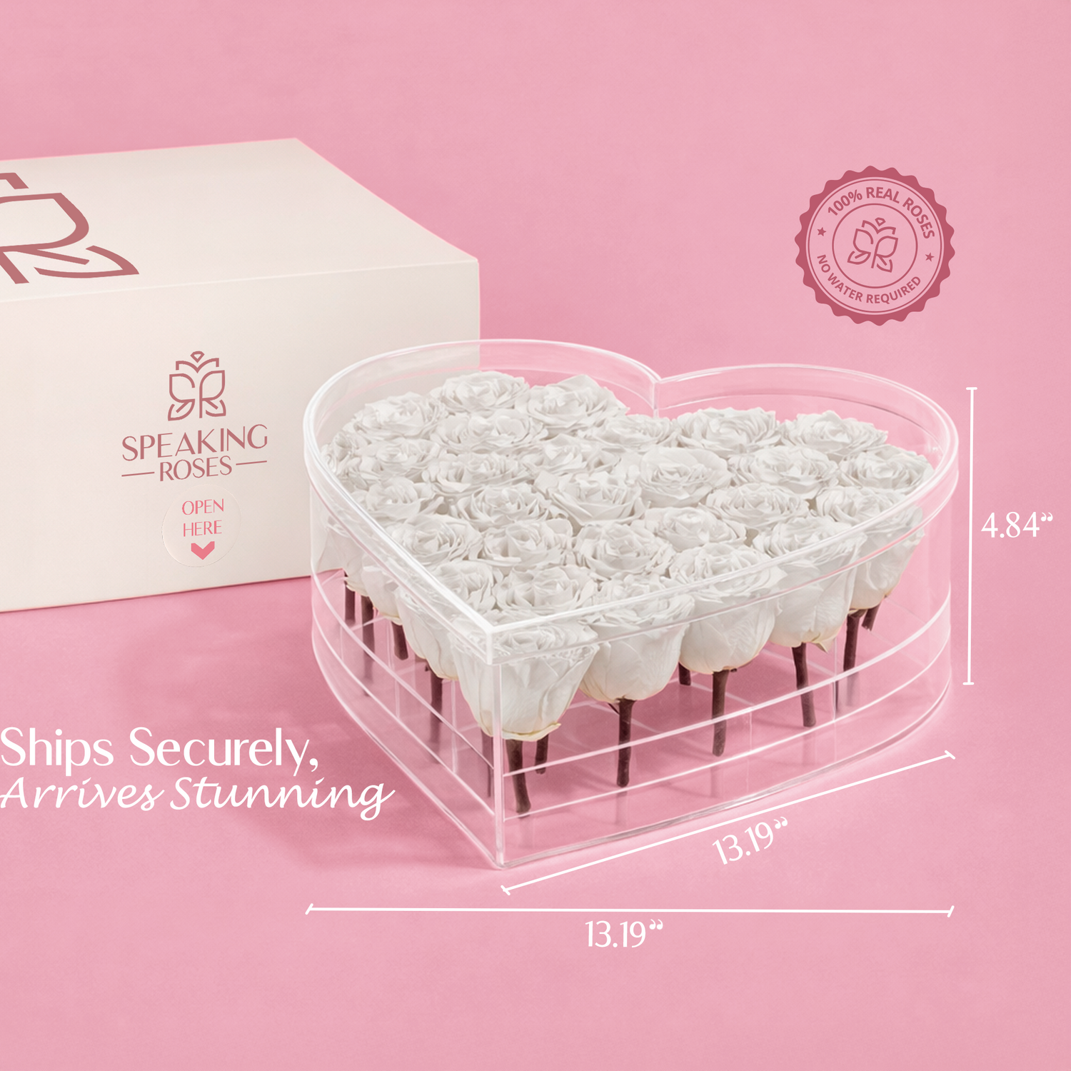 Heart-shaped container with white roses, branded box, and measurement details on a pink background