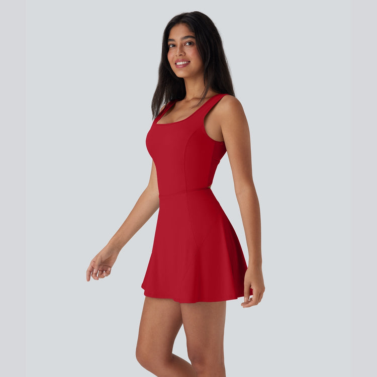 Woman wearing a red dress on a gray background