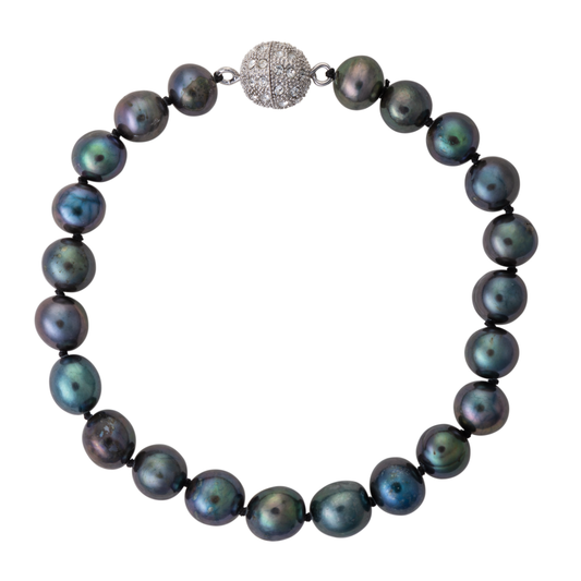 Necklace with dark pearls and a textured silver clasp on a white background