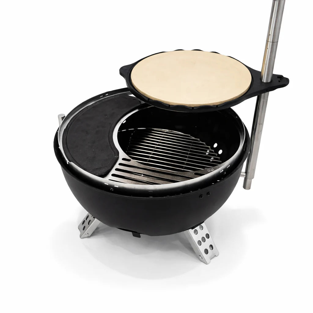 Portable grill with a pizza stone on top, set against a white background