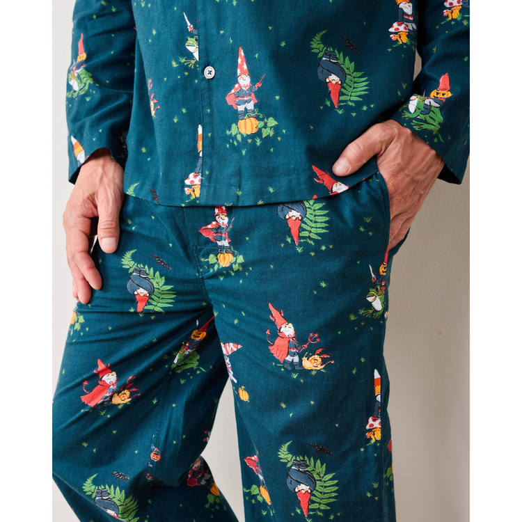 Teal pajama set with gnome pattern worn by a person.