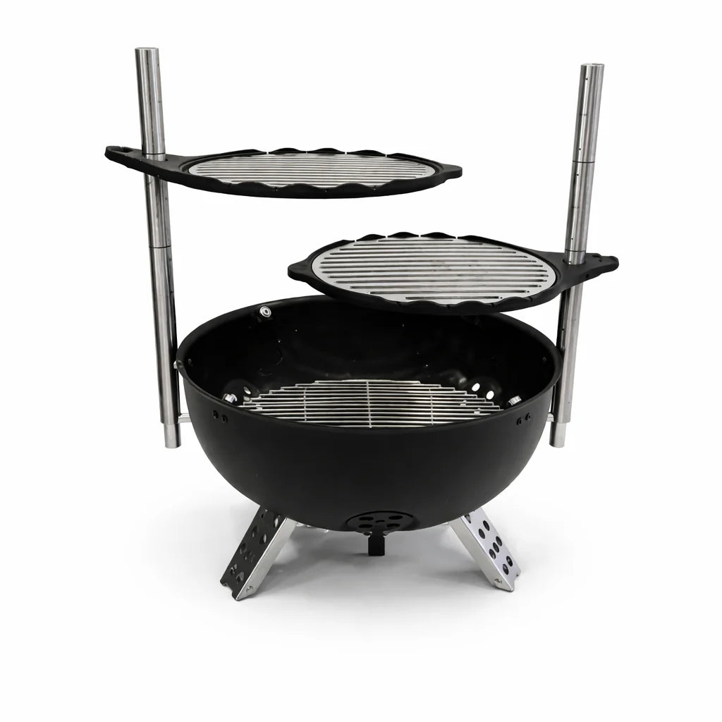 Black portable grill with two additional cooking surfaces on a white background