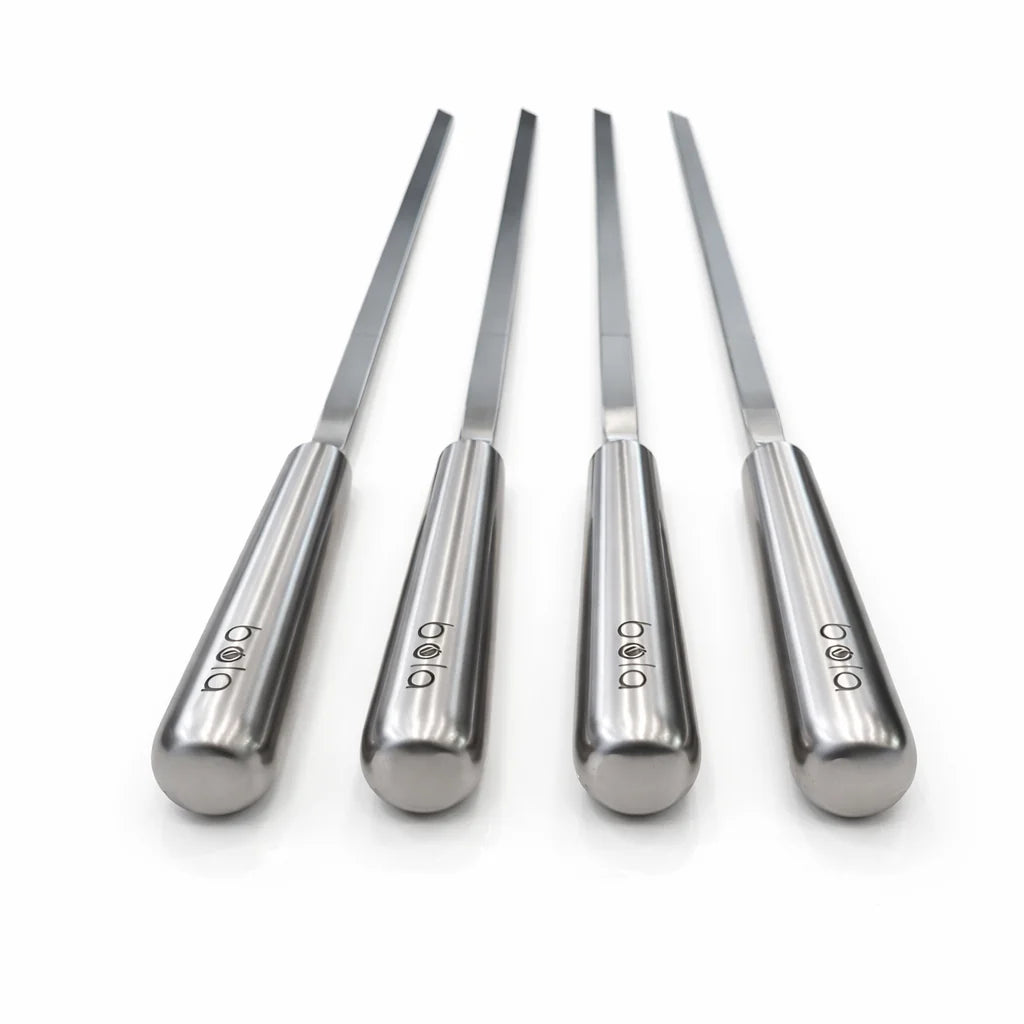 Four silver tools with engraved logos on a white background