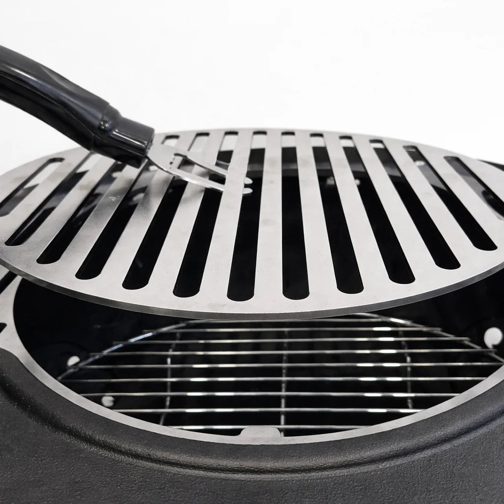 Close-up of a grill with a spatula on a white background