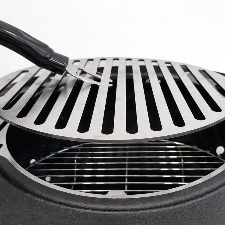 Close-up of a grill with a spatula on a white background