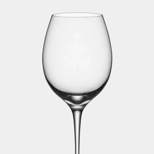 Two clear wine glasses on a light gray background