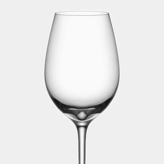 Two clear wine glasses on a light gray background