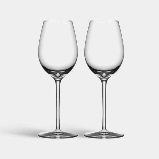 Two clear wine glasses on a light gray background
