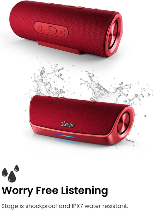 Red portable speaker with 'cleer' branding on a concrete surface outdoors.