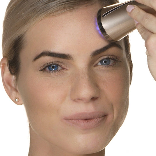 Beauty device and gel primer on a white background