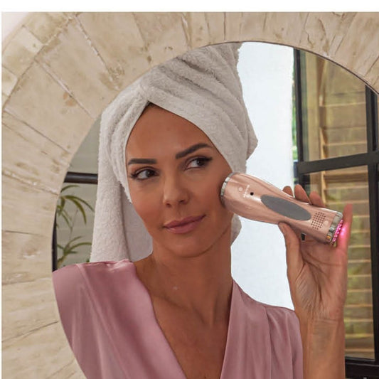 Beauty device and gel primer on a white background