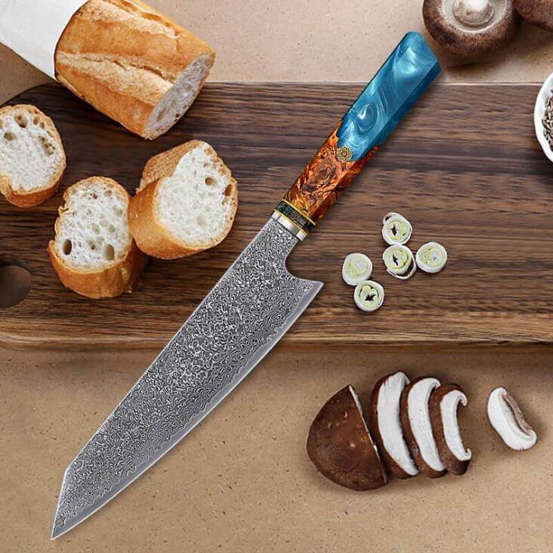 Decorative chef's knife with a wooden handle on a cutting board with bread and mushrooms.