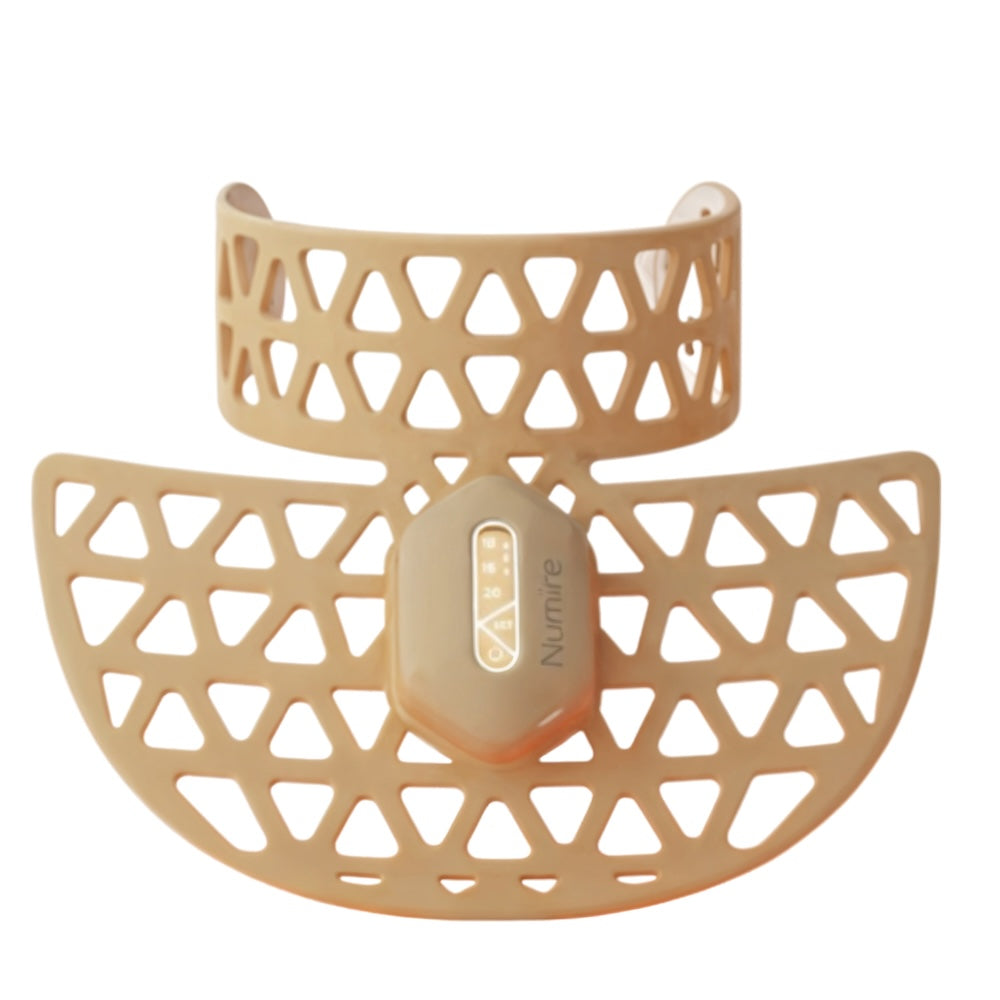 Beige silicone teething ring with geometric pattern on a white background