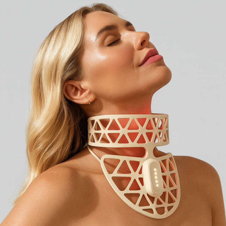 Woman wearing a geometric neckpiece against a plain background