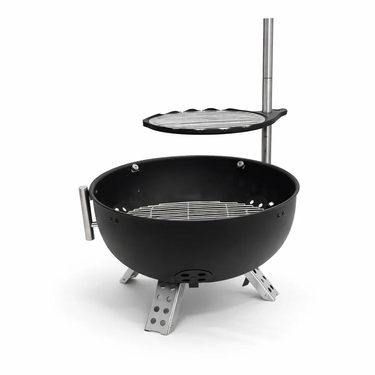 Black portable grill with additional cooking surface on a white background