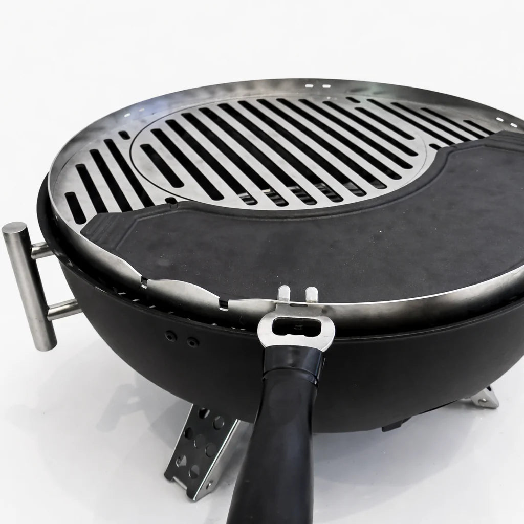 Portable grill with a lid on a white background