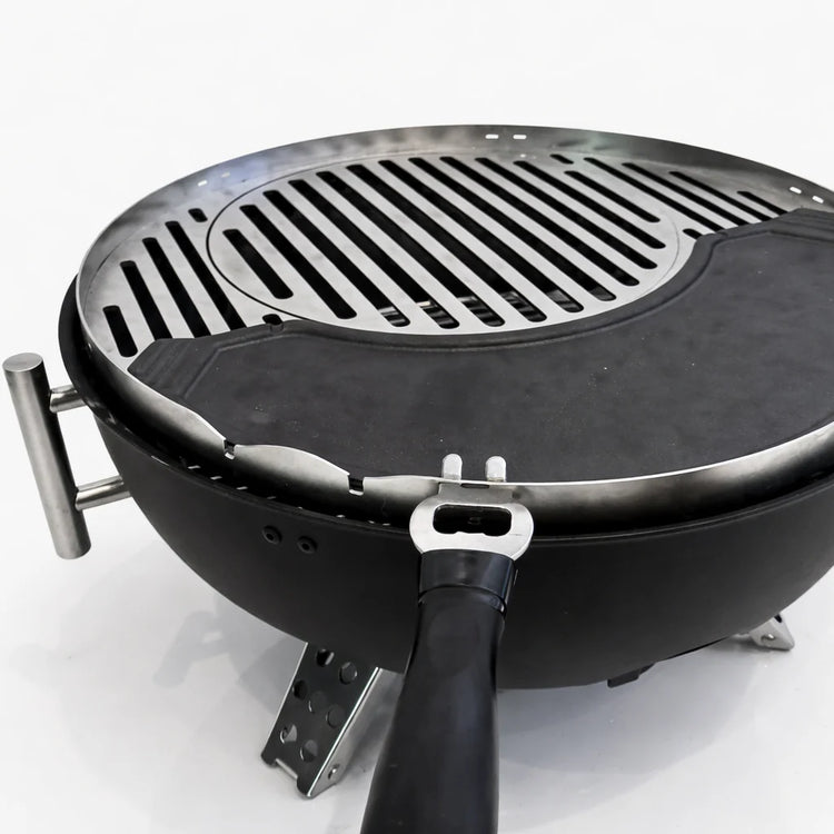 Portable grill with a lid on a white background