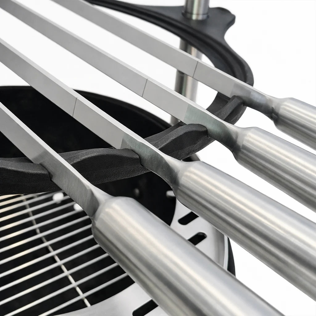 Close-up of a car's three-barreled exhaust system with metallic finish.