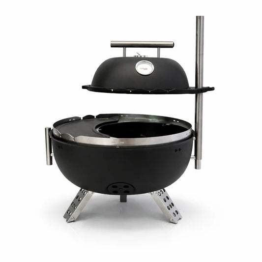 Grill with various foods on a dark surface