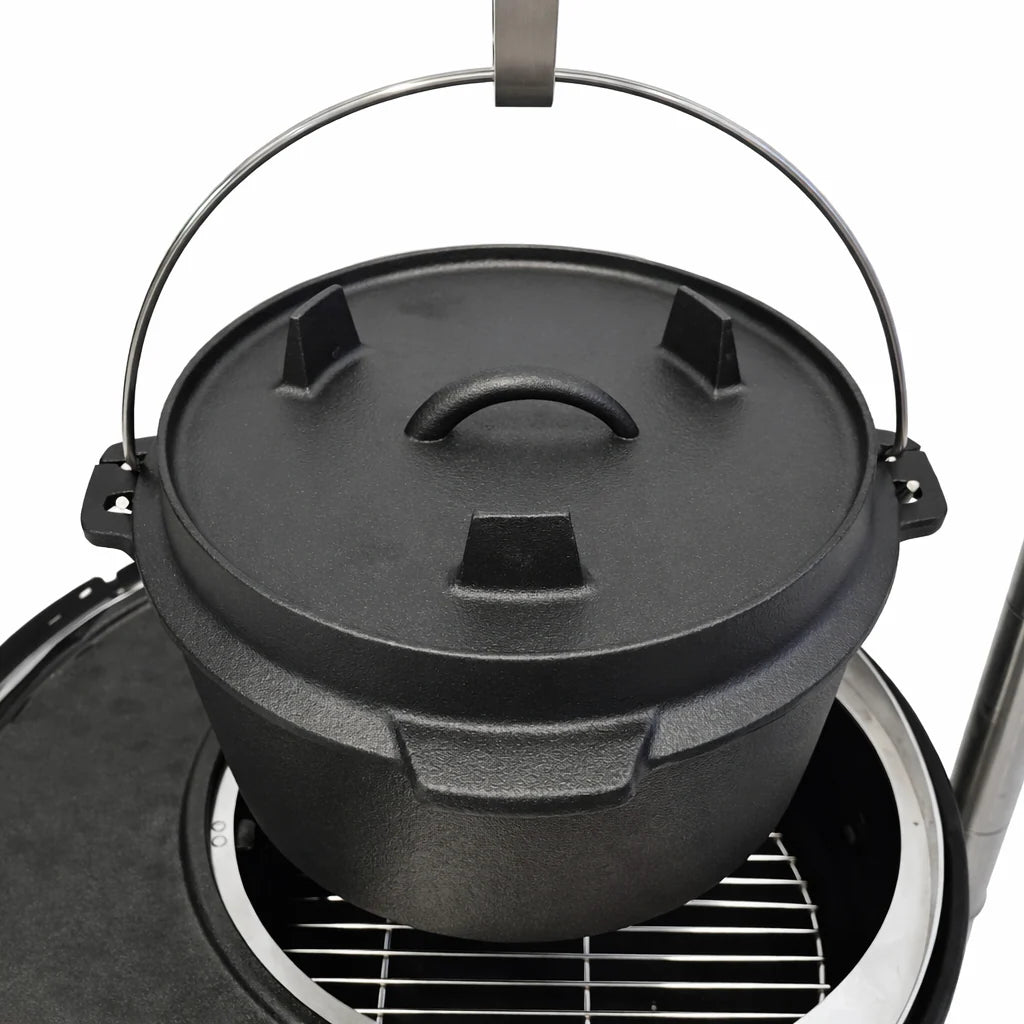 Black cast iron Dutch oven with lid on a white background