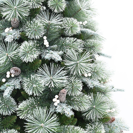 Decorated Christmas tree with lights and presents in a living room with a fireplace.