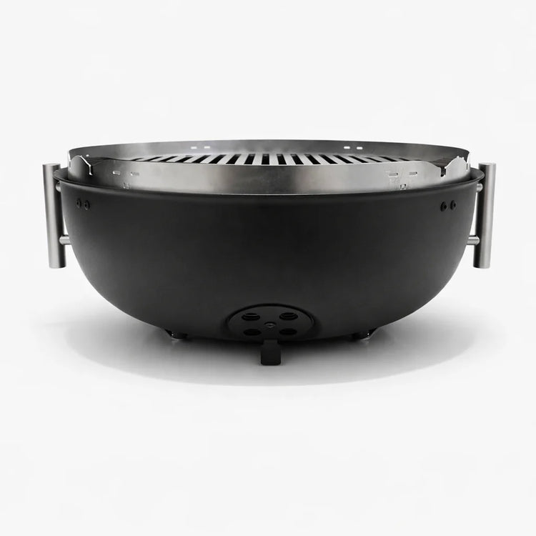 Black fire pit with metal grate on a white background