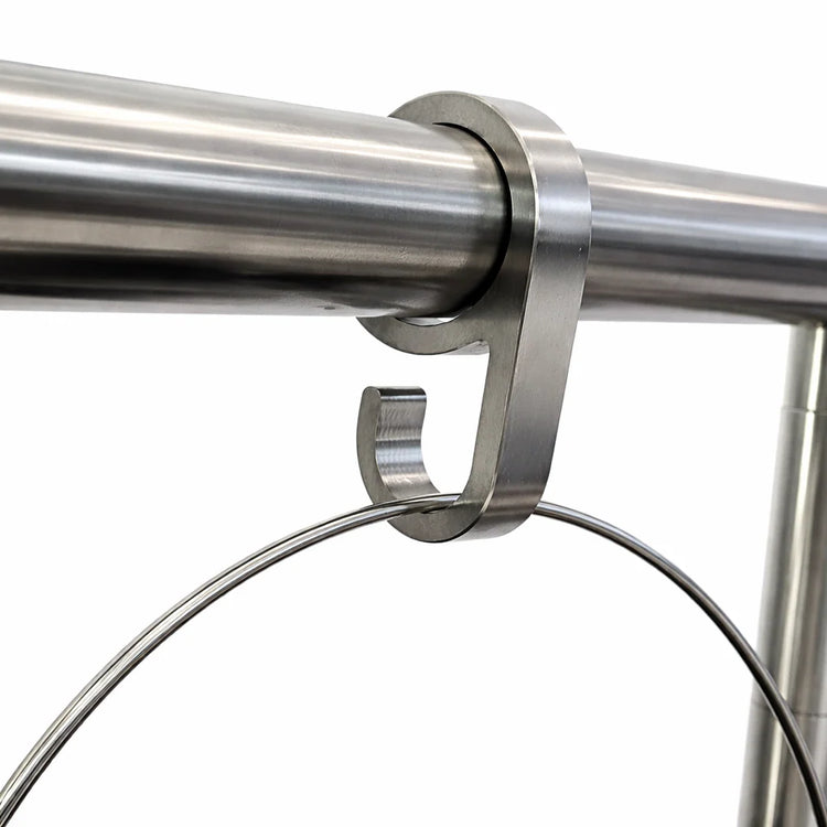 Close-up of a stainless steel shower curtain rod with a bracket on a white background