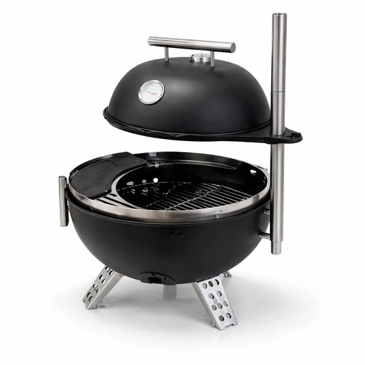 Grill with various foods on a dark surface