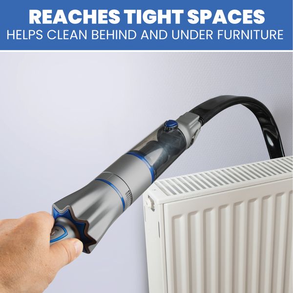 Hand holding a cleaning tool reaching behind a radiator with text 'Reaches tight spaces, helps clean behind and under furniture'.