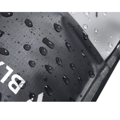 Black textured surface with water droplets and a visible brand logo.