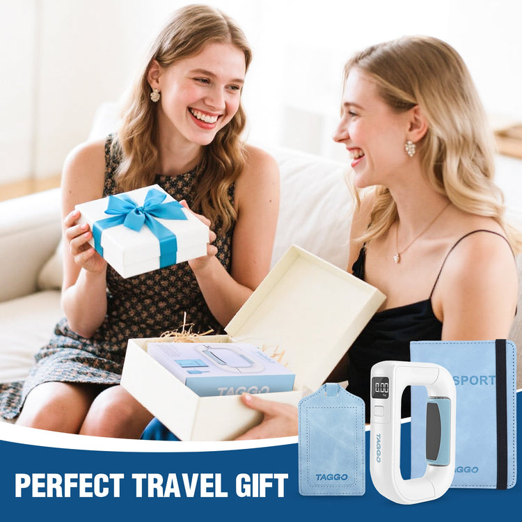 Two women sitting on a couch with travel items displayed in front of them, including a power bank and a water bottle.