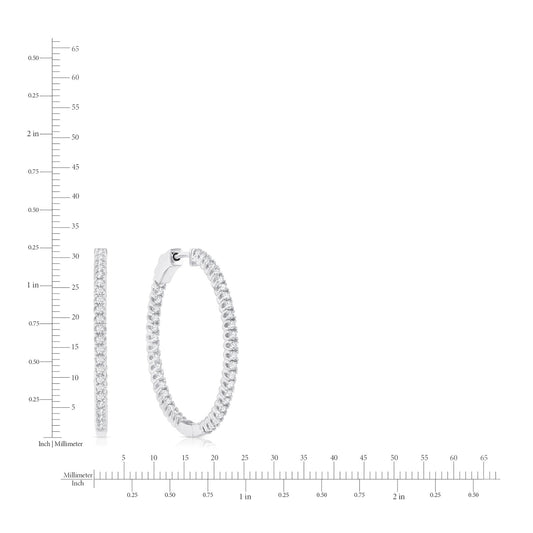 Silver hoop earrings with clear gemstones on a white background