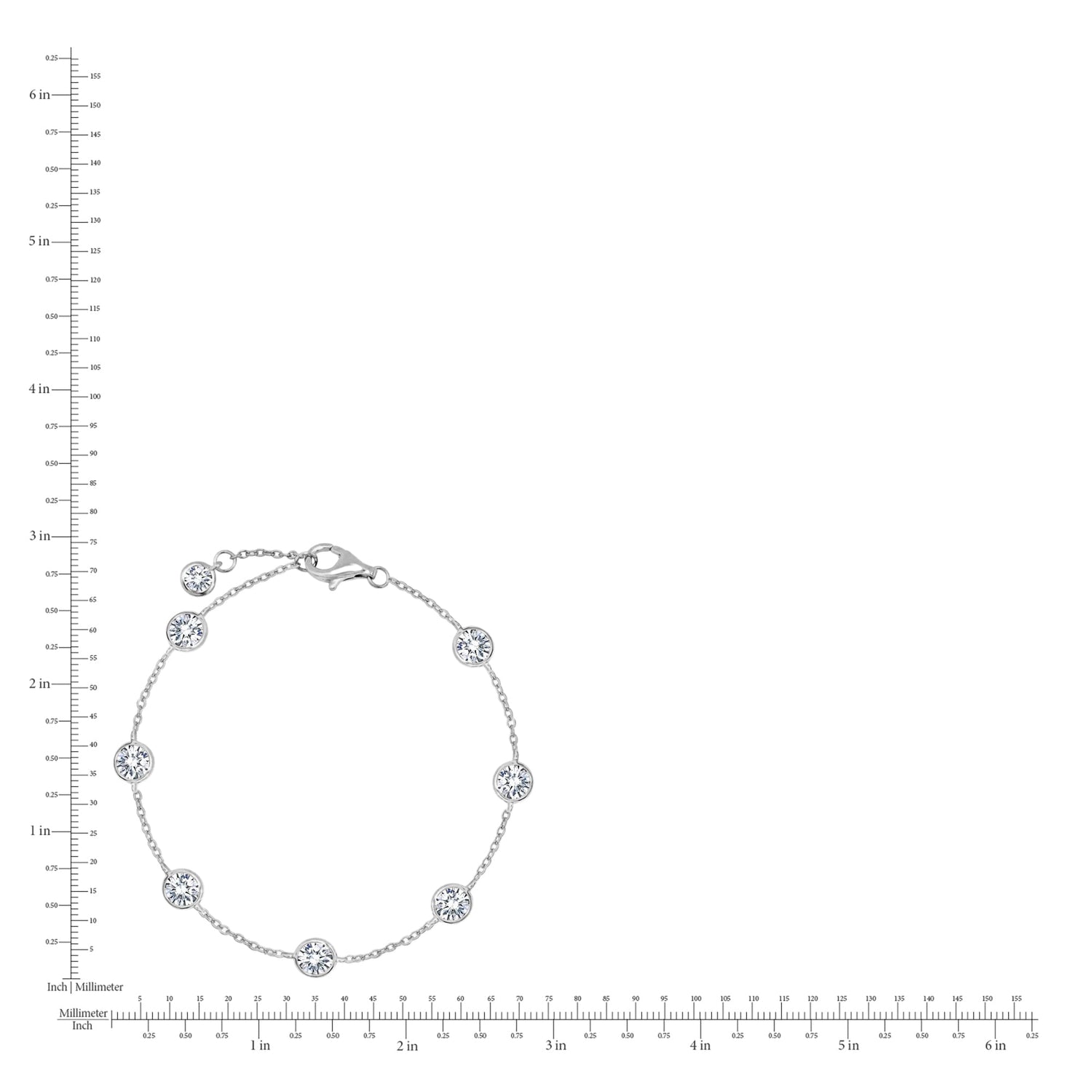 Silver bracelet with floral designs on a white background with a ruler for scale.