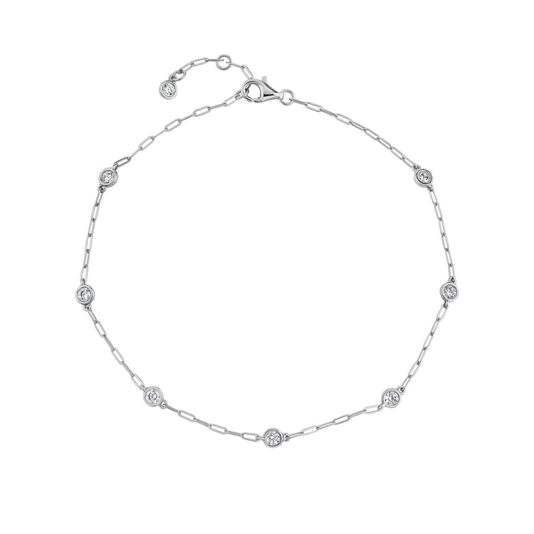 Silver bracelet with small diamonds on a white background