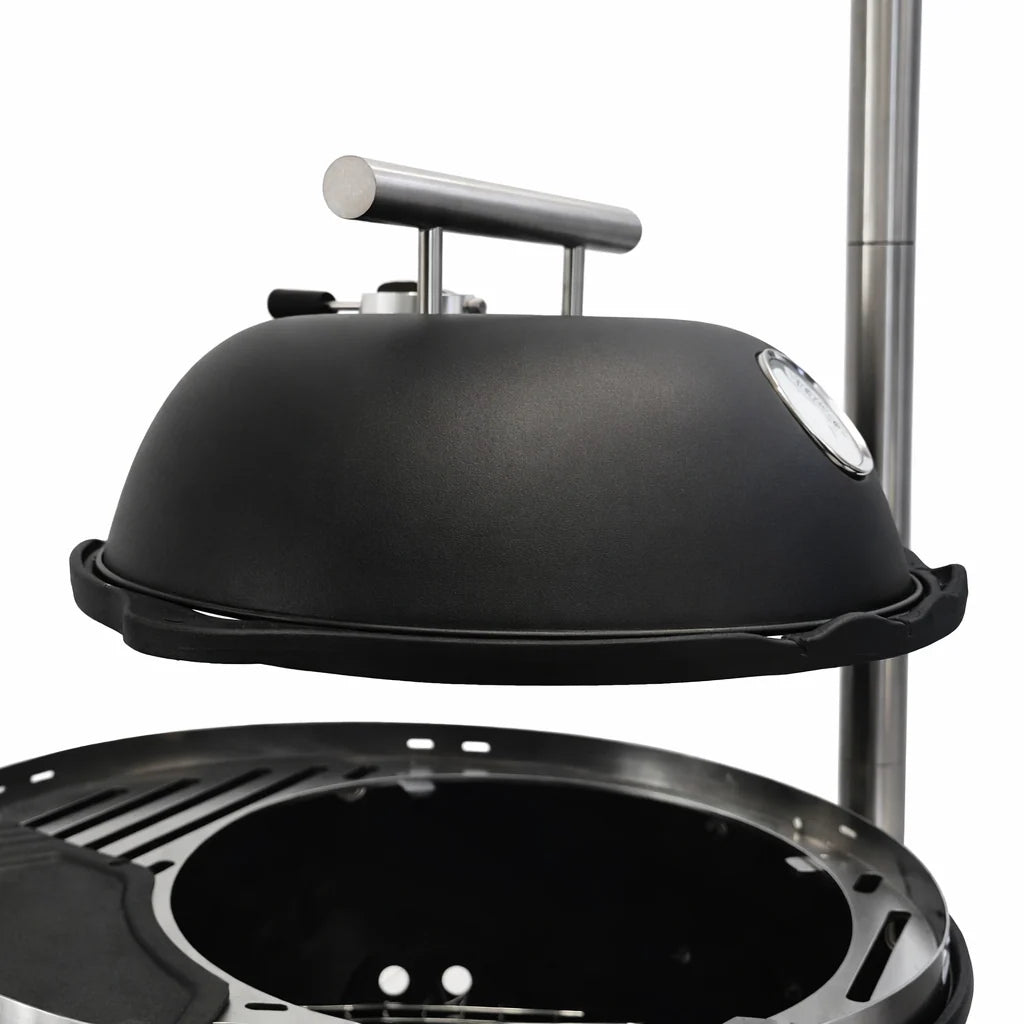 Black barbecue grill with dome lid on a white background