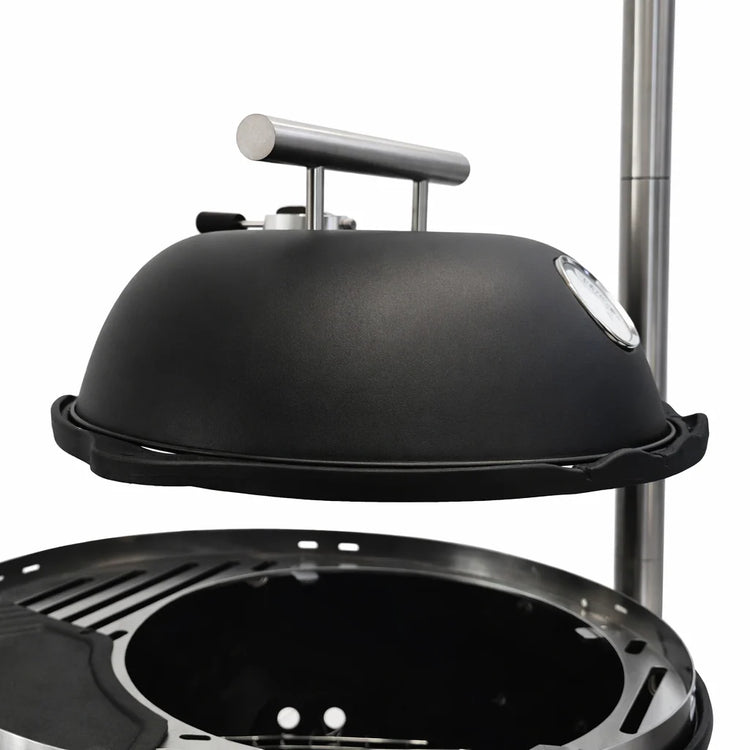 Black barbecue grill with dome lid on a white background