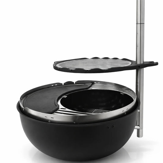Outdoor dining scene with a portable grill, food, and people enjoying a meal.
