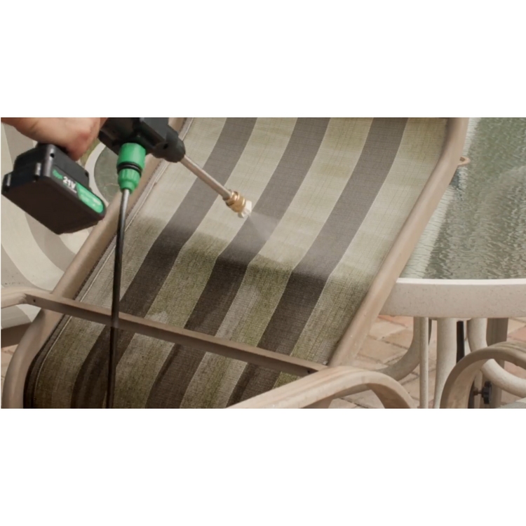 Person cleaning a patio chair with a pressure washer.