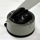 Knife sharpener with a knife inserted on a white background