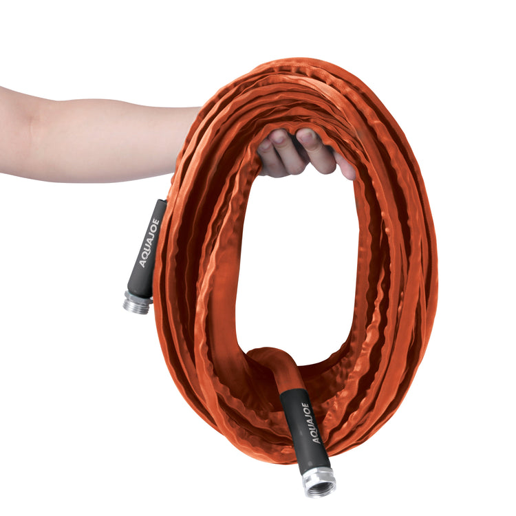 Orange garden hose with black connectors held by a person on a white background